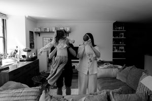 Black and white candid photos capturing intimate moments in a home setting.