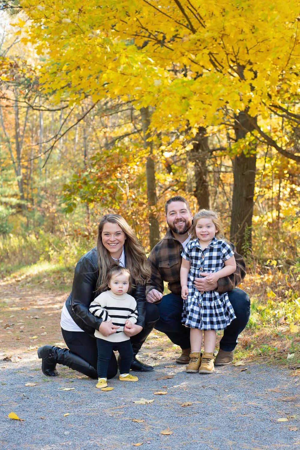 Family of four, family portrait outdoors in Northumberland Forest, Ontario in fall.*