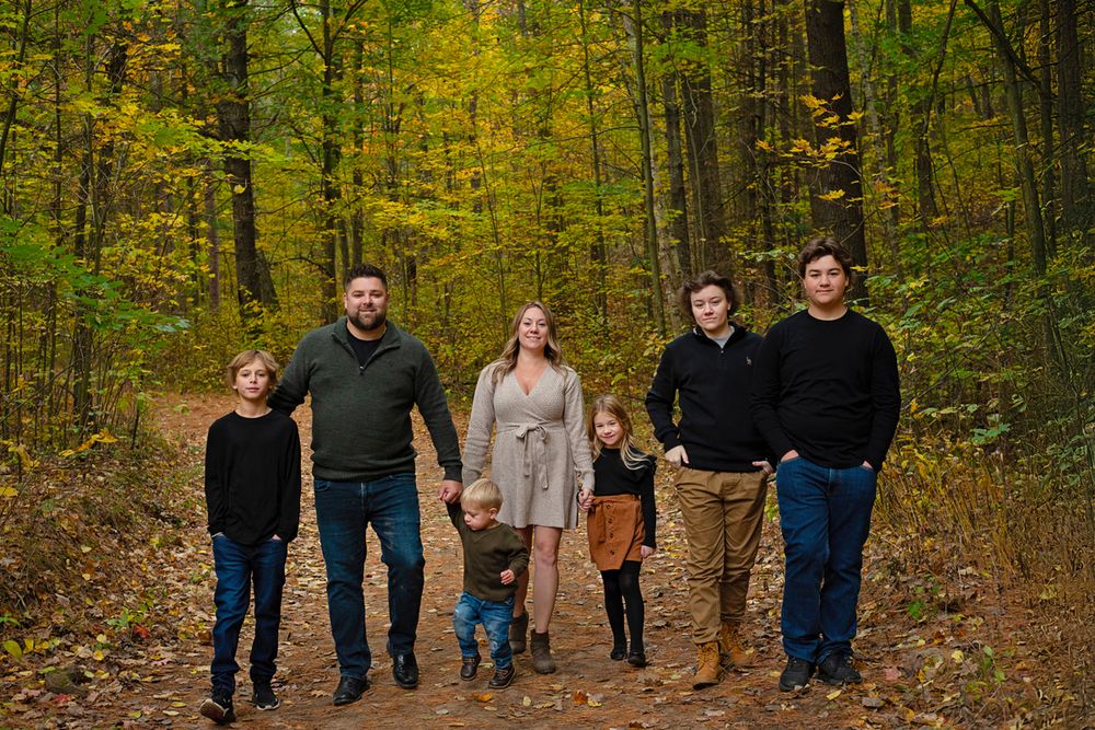 Large family walking in Northumberland Forest in the fall*