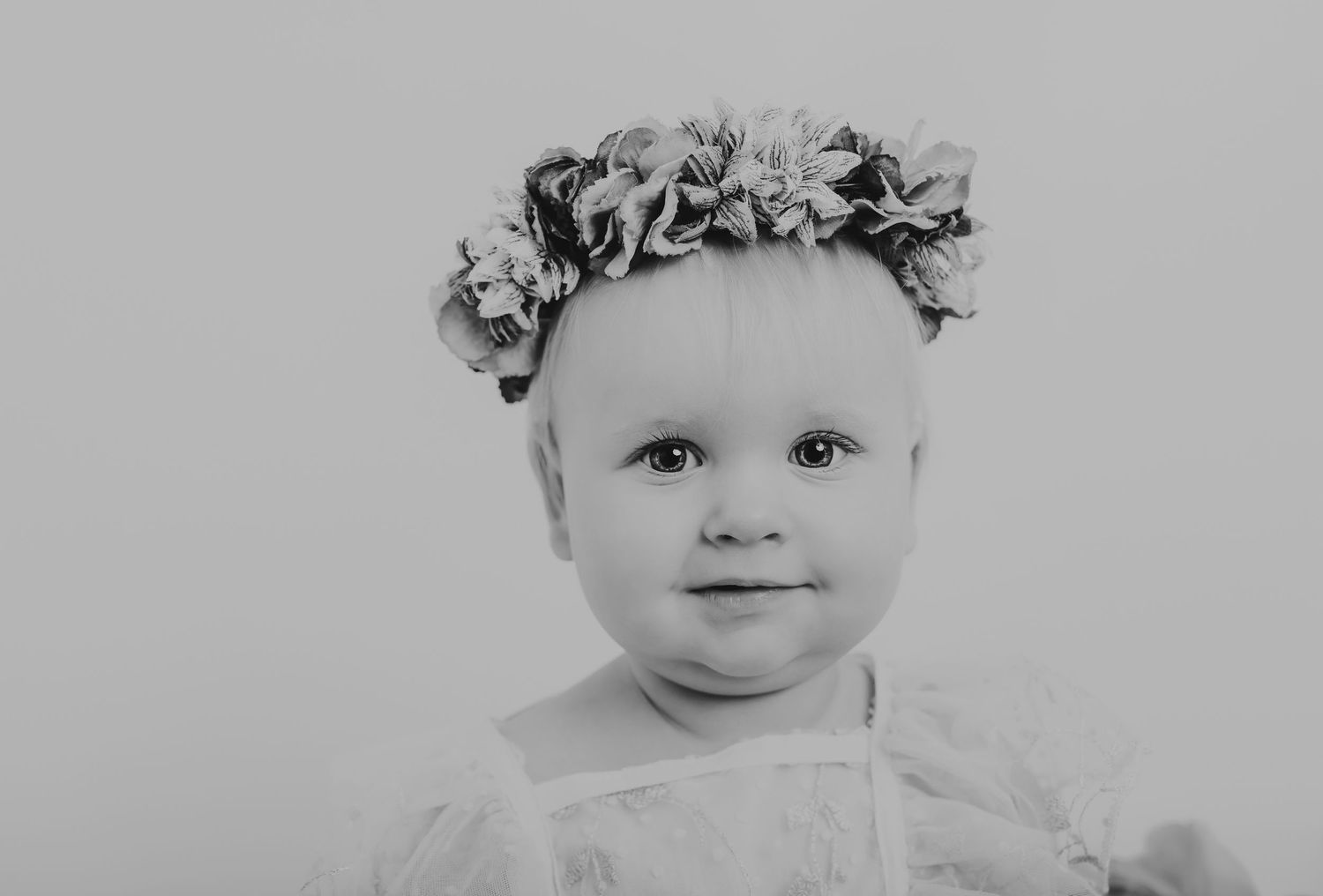 Soft black and white portrait of a baby wearing a floral crown. Photographer. Hull. East Yorkshire. Photography