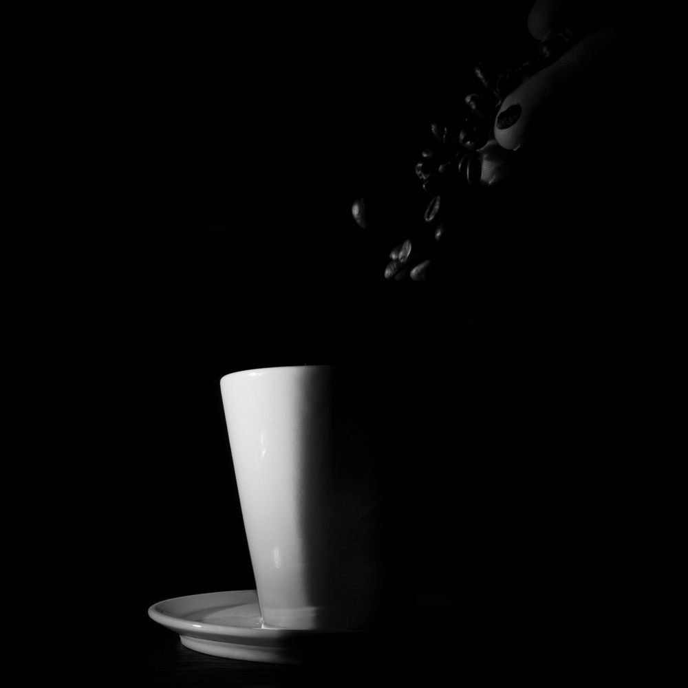 Sequence of black and white images showing a ceramic cup with dramatic shadows against a dark background.