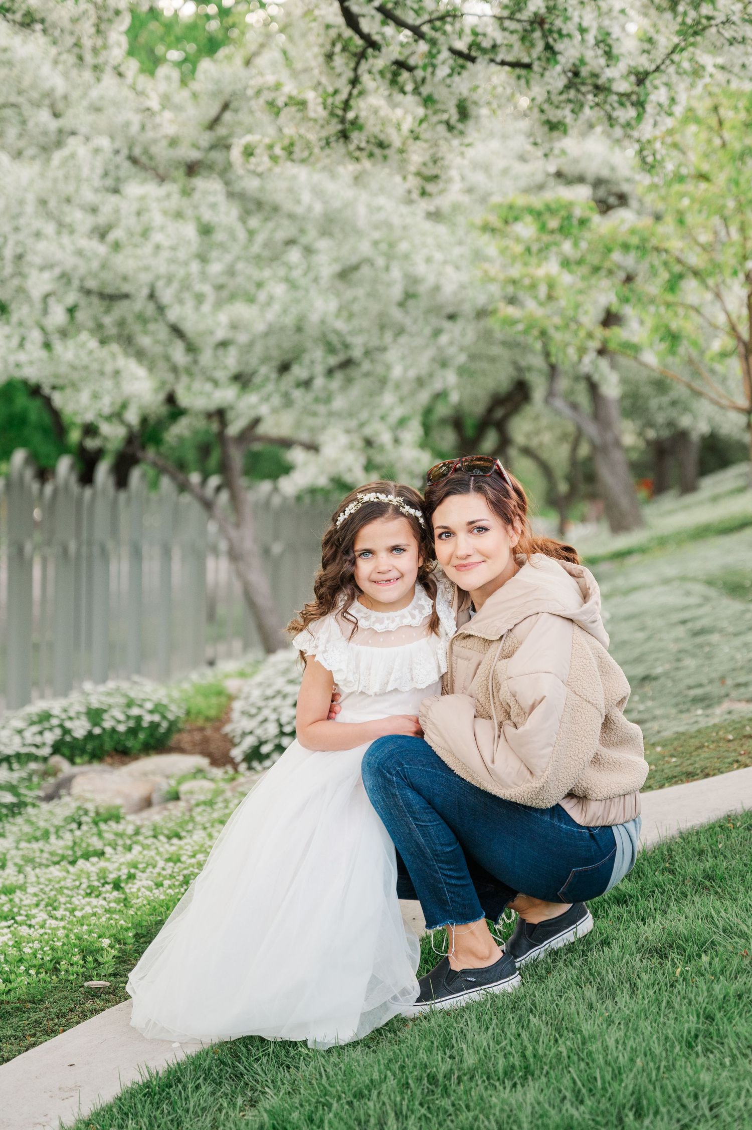 Special portrait in spring garden with white blossoms and water feature.