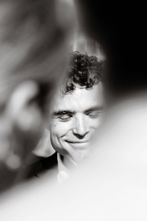 An artistic black and white close-up portrait with soft focus effects.