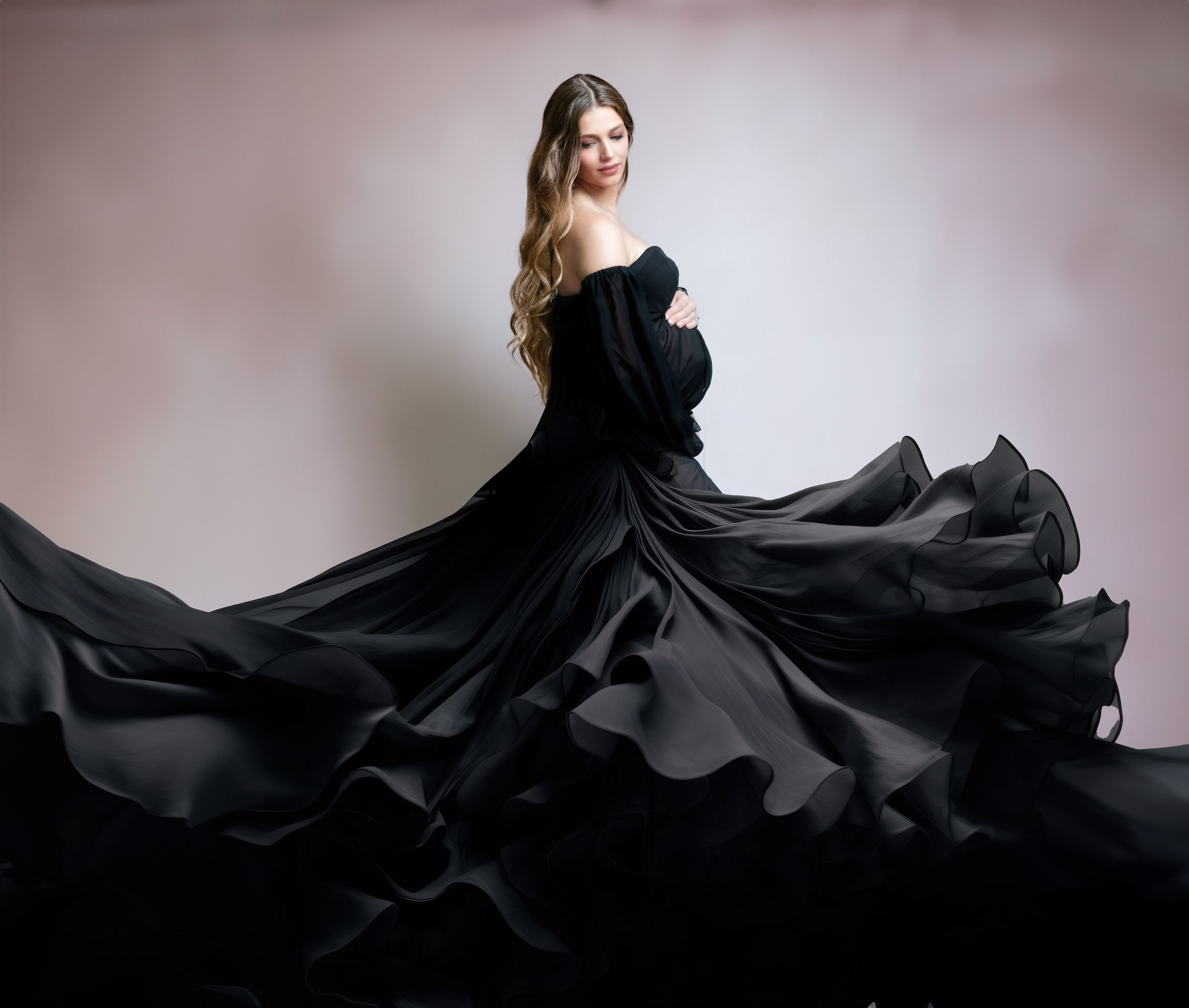 Dramatic black gown with sweeping flared skirt in elegant motion.