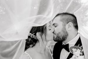 Romantic black and white wedding portraits showing tender moments between newlyweds.