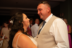Leanne & Tom looking at each other before first dance