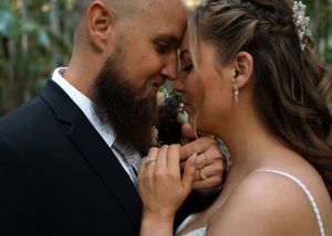 A romantic wedding couple shares an intimate moment together in a series of tender close-up shots.