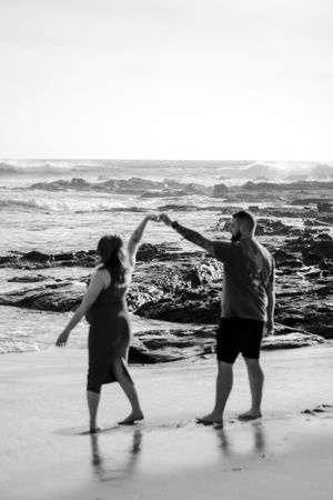 A couple dancing on the beach.