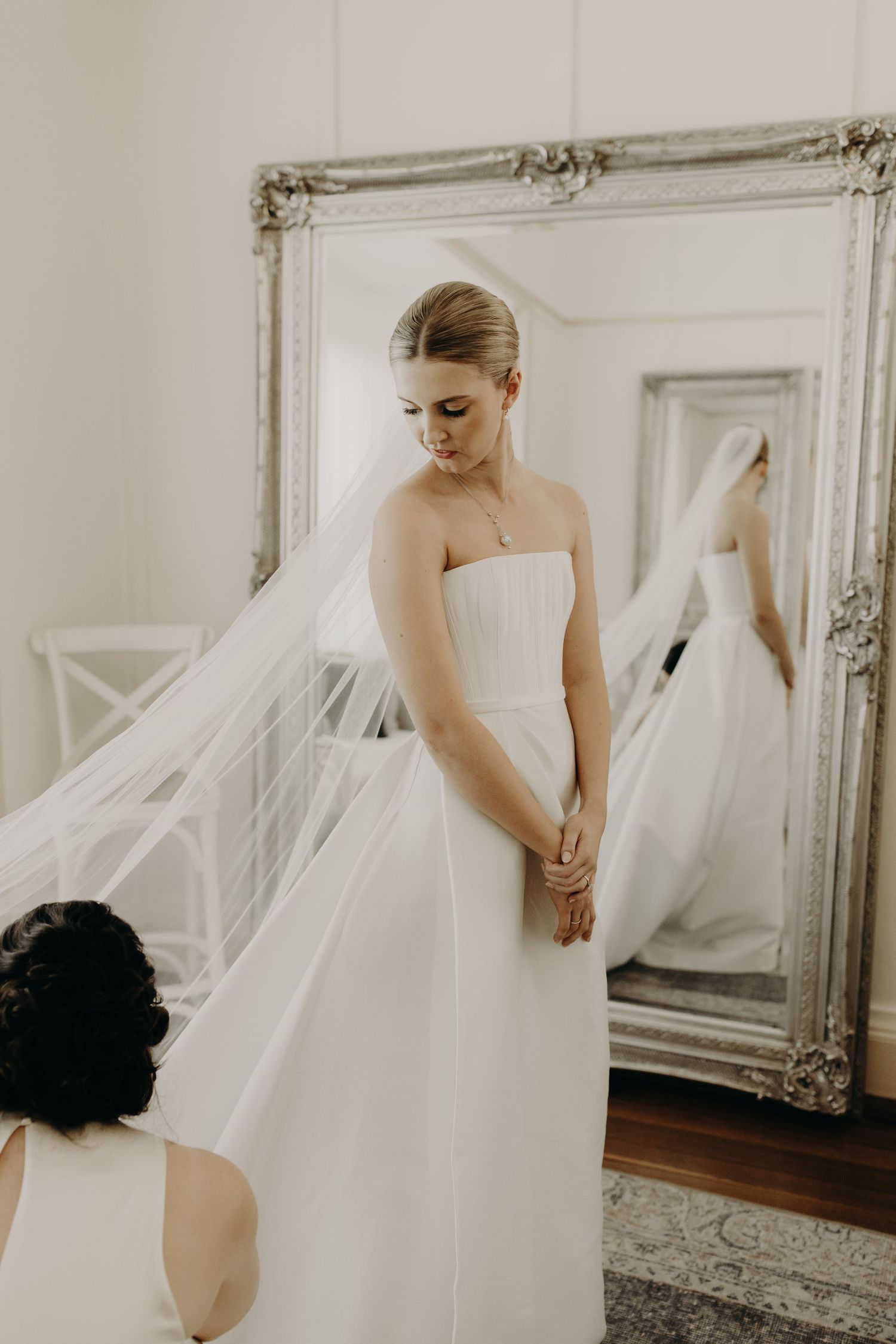 Artistic wedding photography sequence with flowing veil and ornate mirror reflections.
