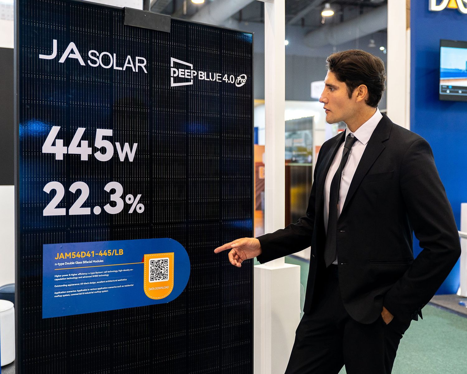 business man pointing and panel on a business fair