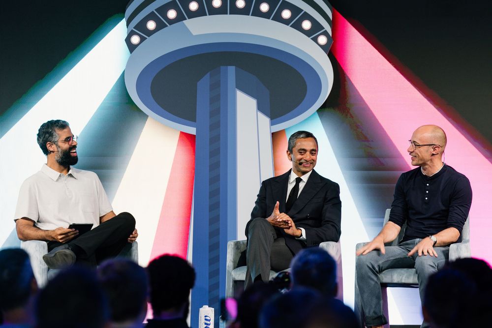 A series of business event photos showing people engaged in discussion on stage with pink and blue lighting effects.
