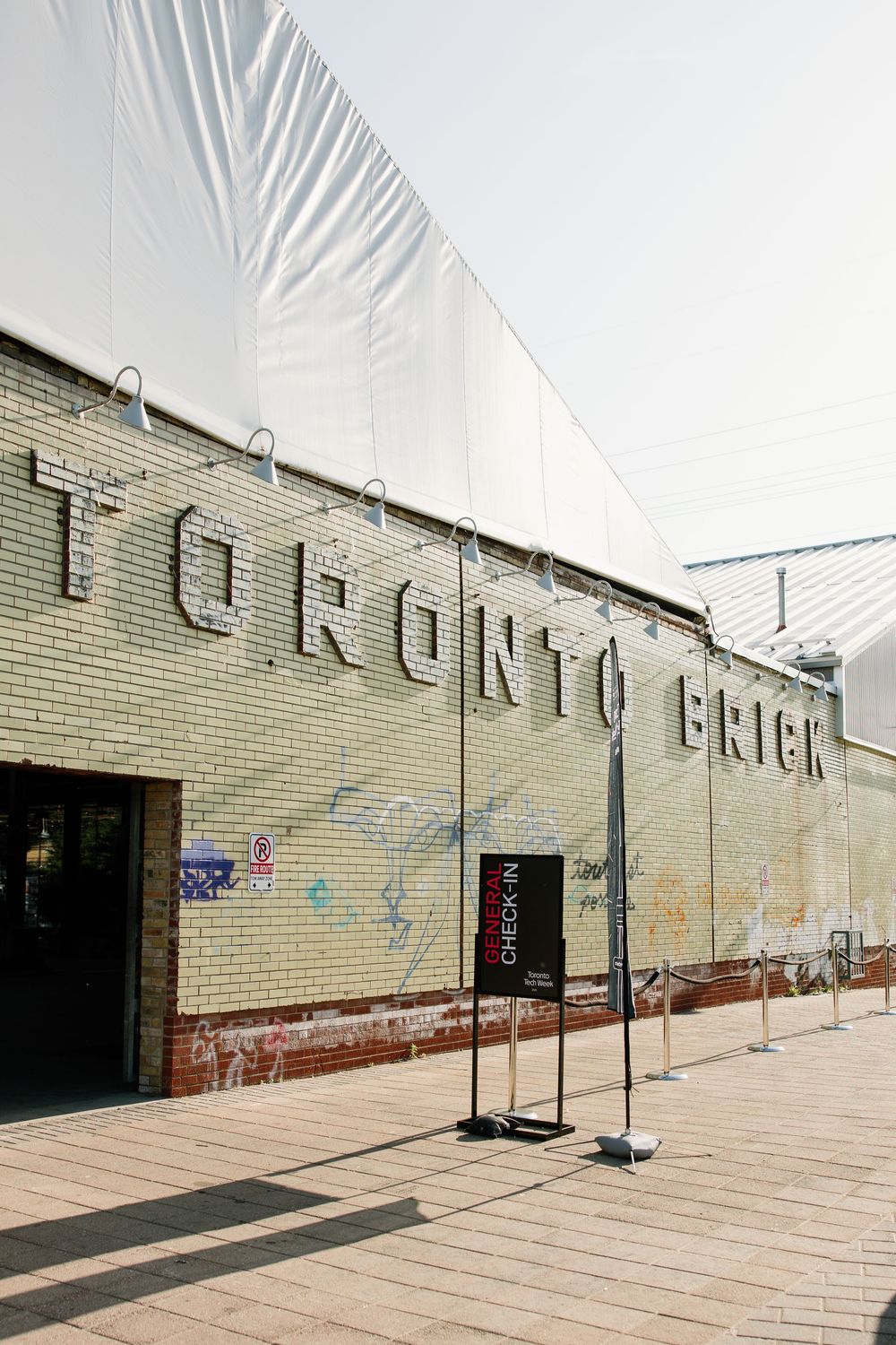 A brick wall with graffiti removal showing multiple angles of the same exterior building facade.
