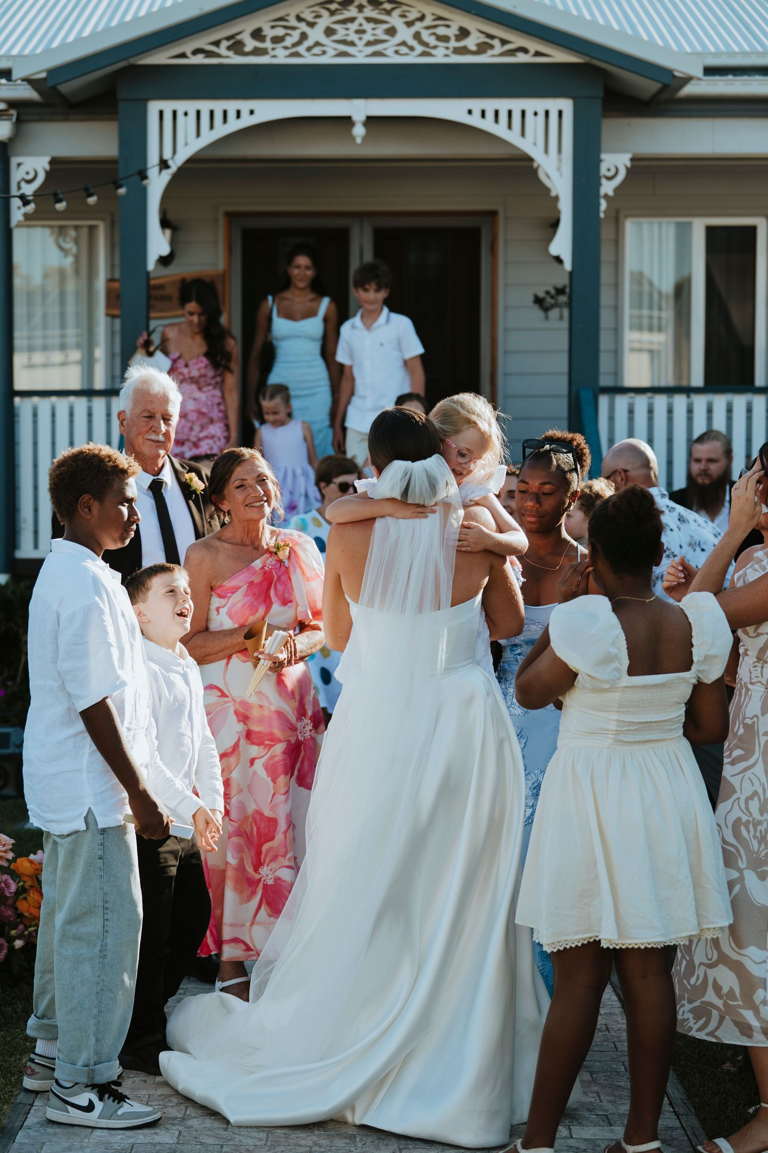 Black and white nighttime wedding photo with soft motion blur effect.