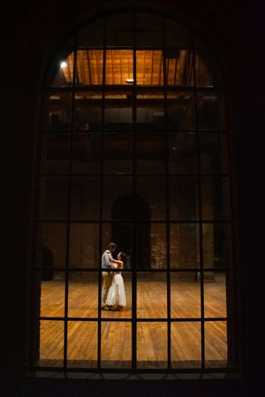 Couple dancing in window in Richmond, Virginia