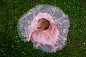 Baby’s first birthday photos in flower dress