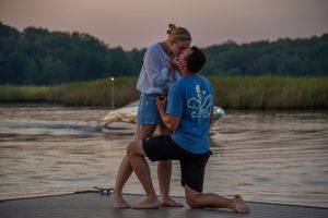 Couple kissing after man proposed