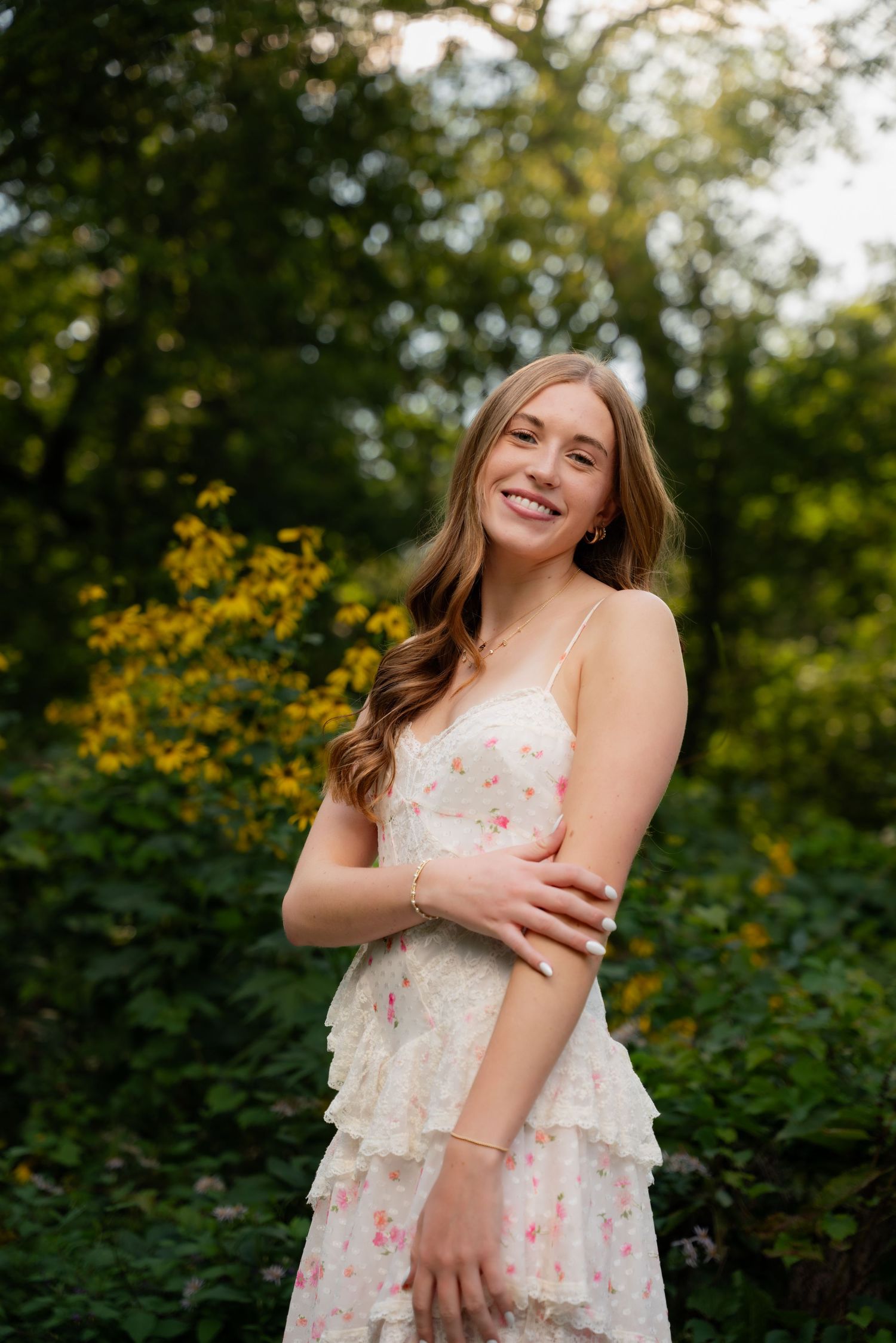 Natural portrait of someone resting in a hollow tree trunk with joyful expression.