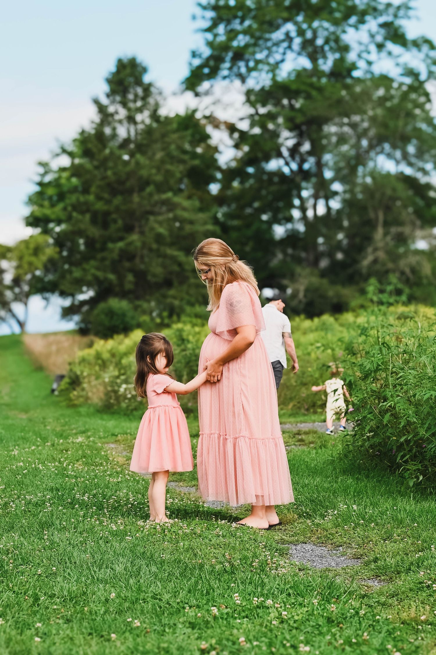 Daughter touches mamas belly during maternity session with Krista Manchuck, Hudson, NY