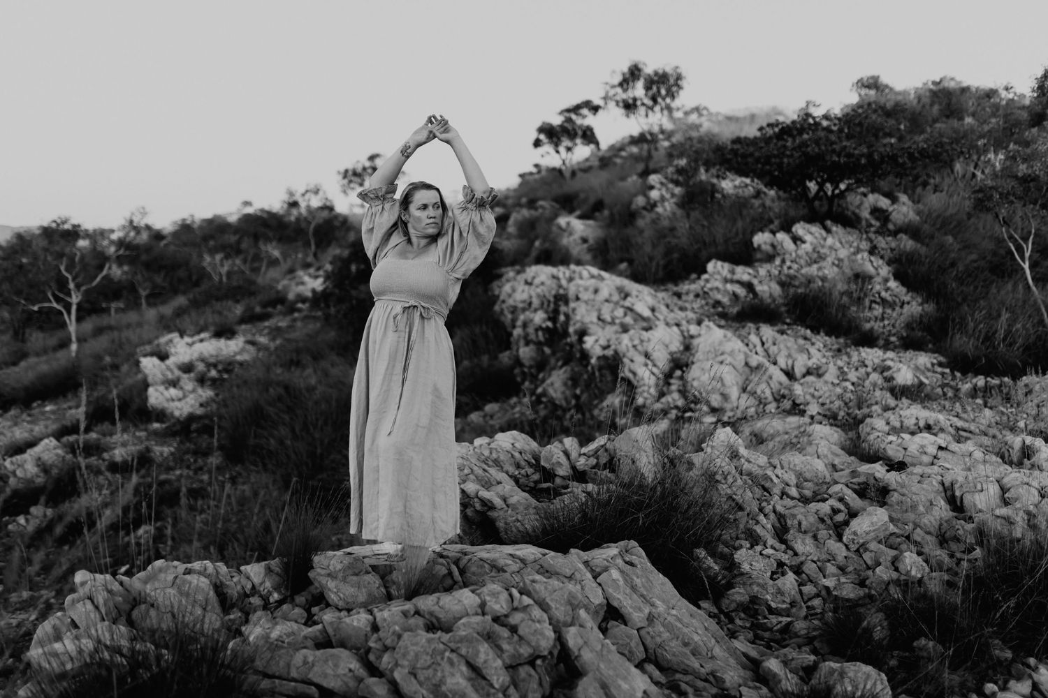 Woman embracing the wind up wallaby walk way at Lake Moondarra, Mount Isa