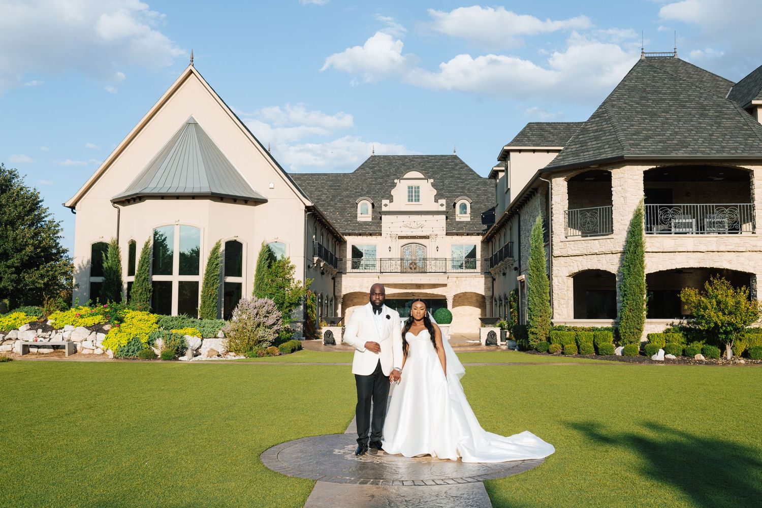 Bride and groom walking at Knotting Hill Place wedding venue in Texas.
