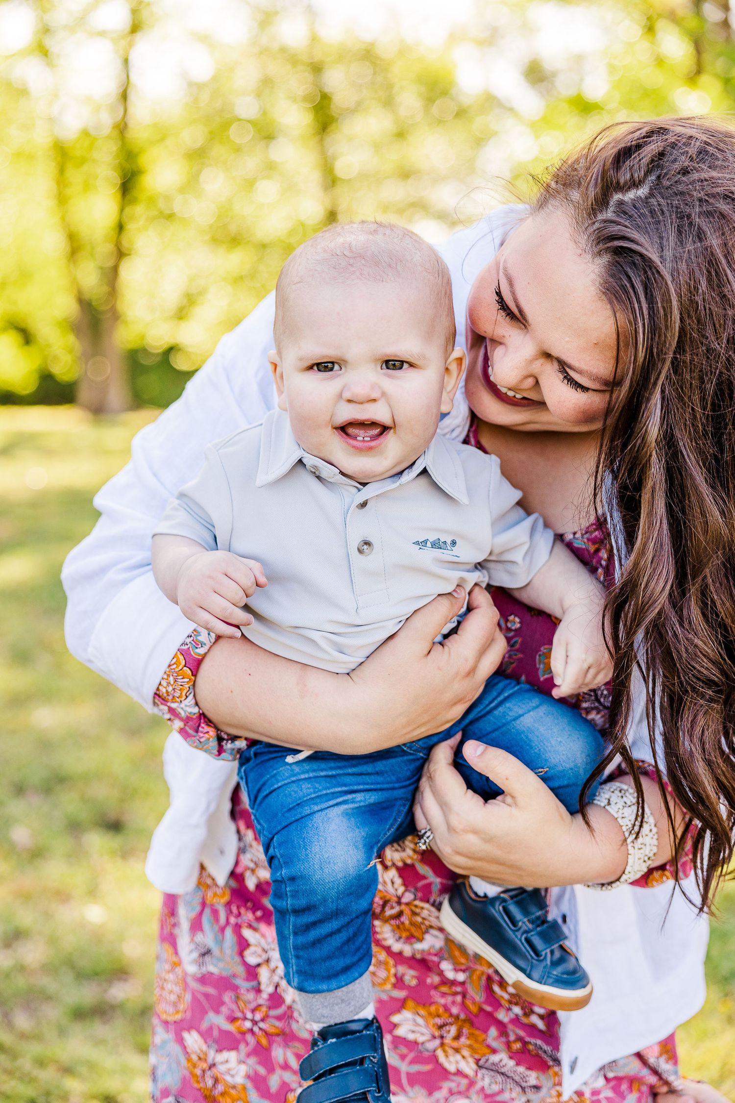 Joyful moment captured outdoors in sunny natural setting.