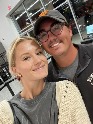 Casual selfie of a woman and her husband on a date night.