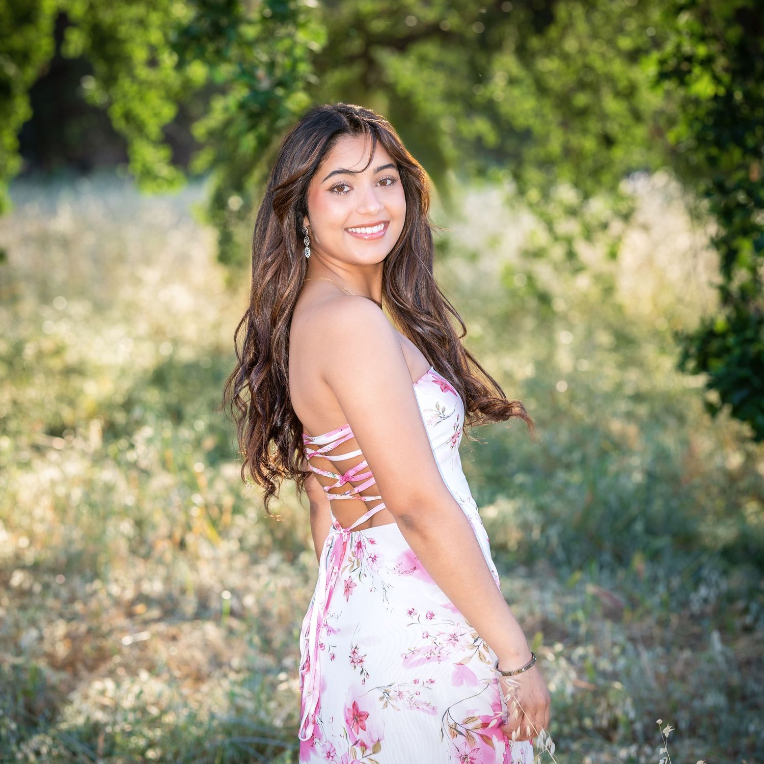 Blonde teen in pink prom dress