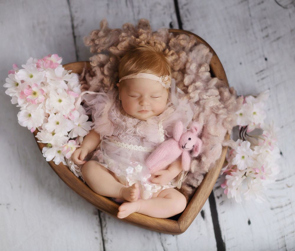 Beautiful baby girl photography in a heart bowl, based in Coventry.