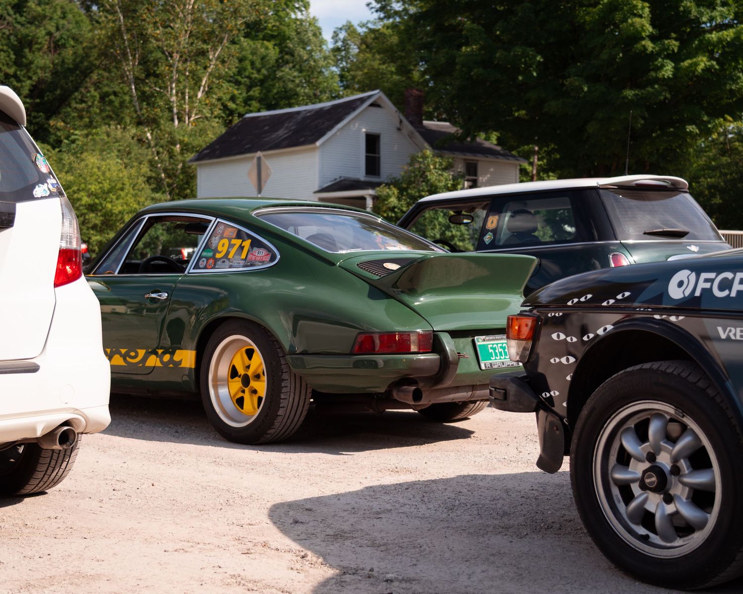 All Day Breakfast Rally Cars - Black OHOAT! Saab 99, Green Porsche 911 Carrera, White Honda Fit Sport, and Green Mini Cooper.
