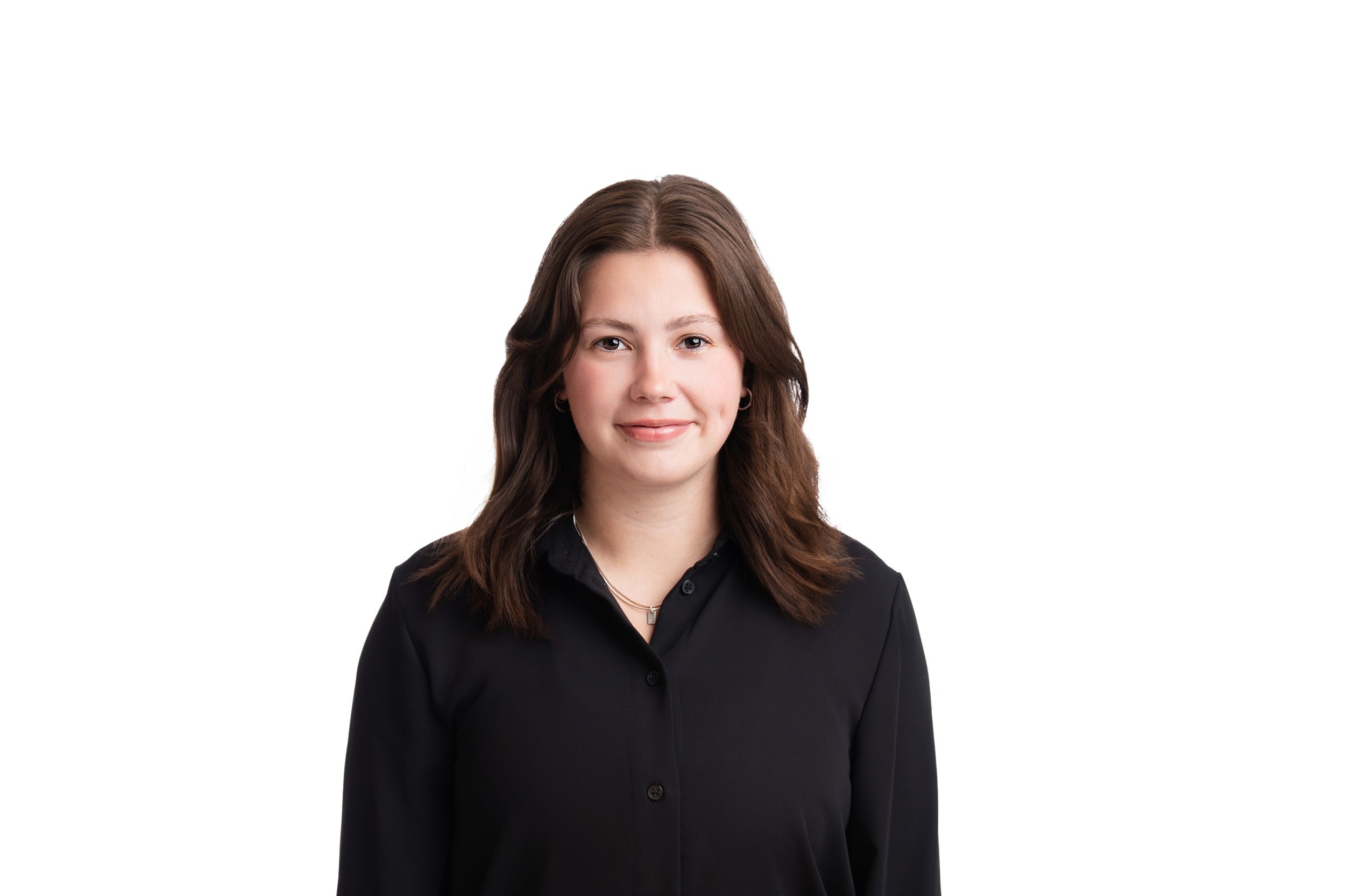 Professional headshot of someone wearing a black button-up shirt against a white background.