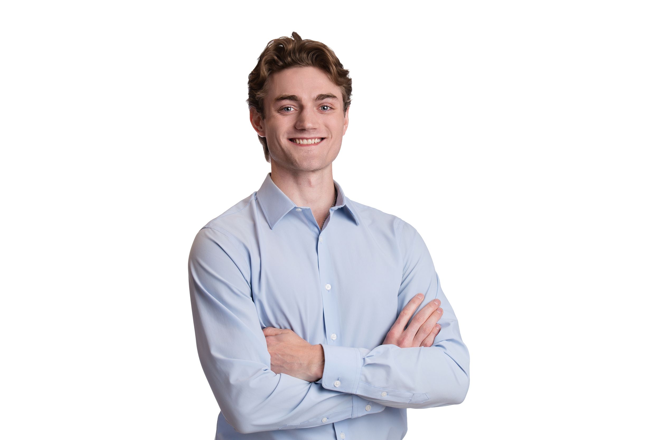 A headshot of a person wearing a light blue button-down shirt against a white background.