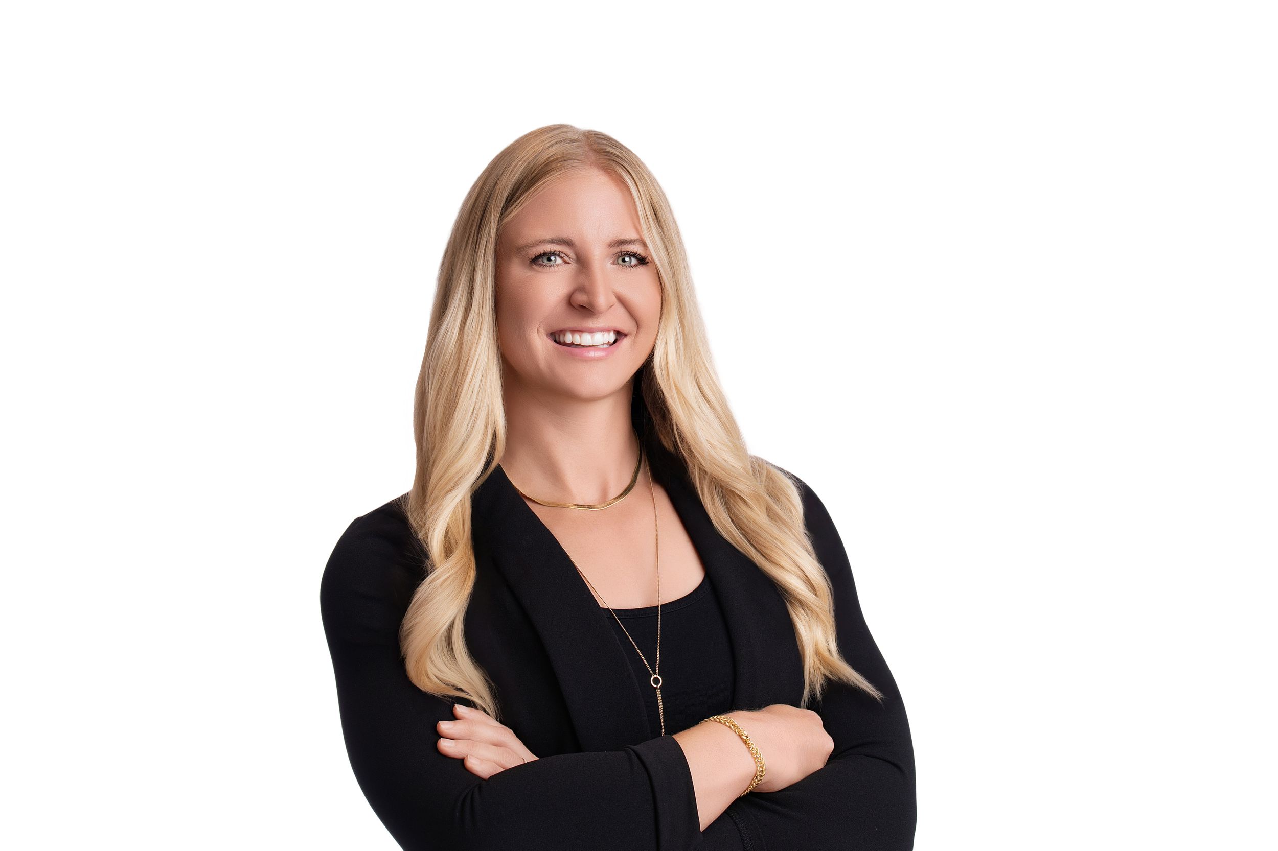 A blonde woman in a black top poses for professional headshots in four similar poses against a white background.