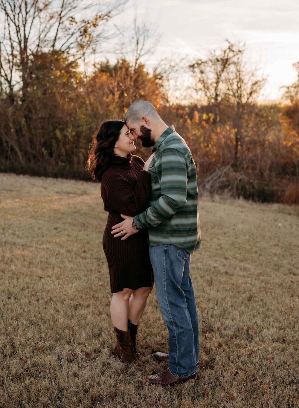 A couple shares tender moments in a golden autumn field at sunset, captured in a series of romantic poses.