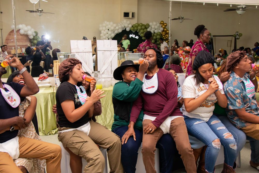 Group of party guests react enthusiastically during a social gathering event.