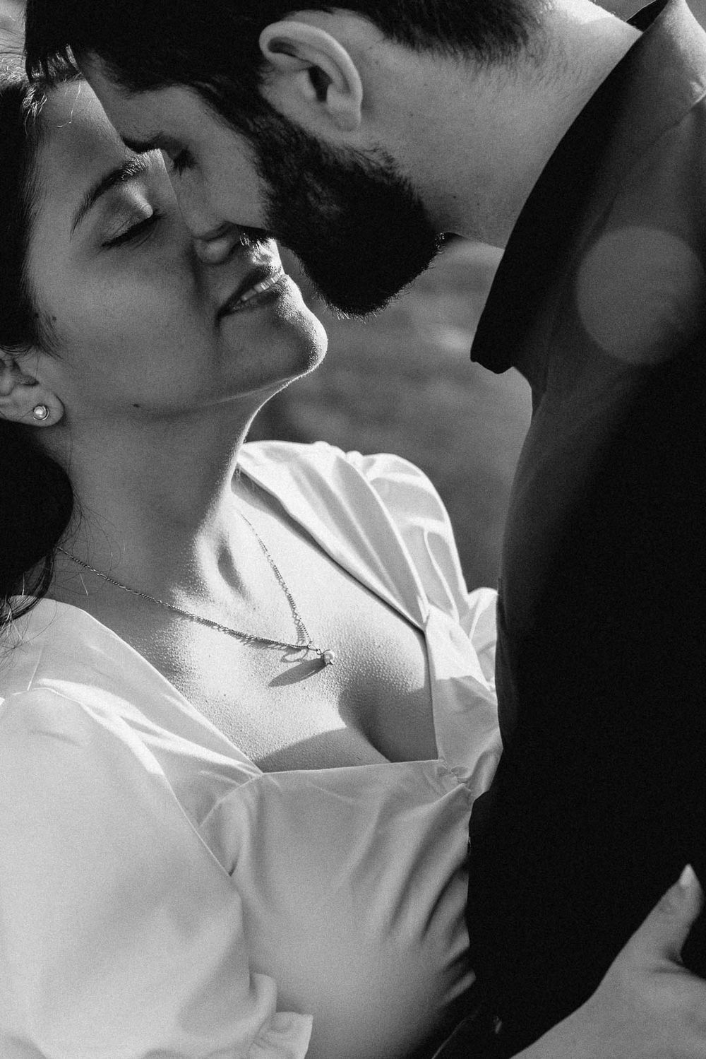 Intimate black and white engagement portrait of a couple sharing a quiet moment, captured by Cleveland wedding photographer.