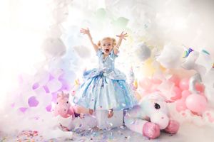 Dreamy pastel photo setup with soft pink balloons and delicate tulle dresses.