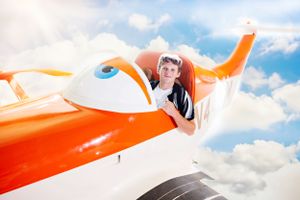 Series of shots featuring orange and white small aircraft against blue sky with puffy clouds.