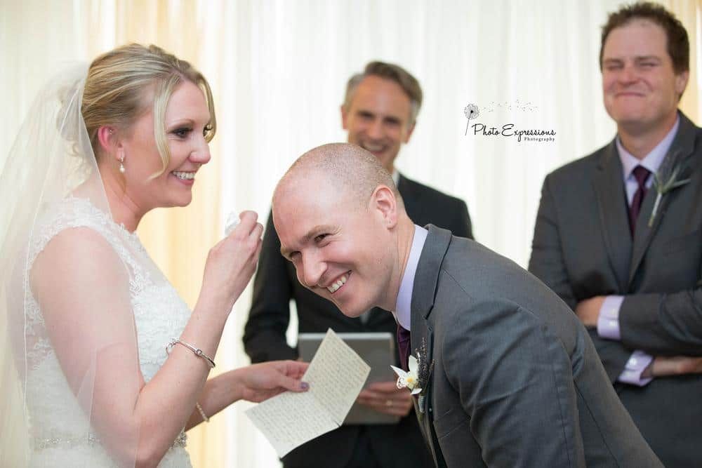 A wedding couple shares an intimate moment during their celebration.