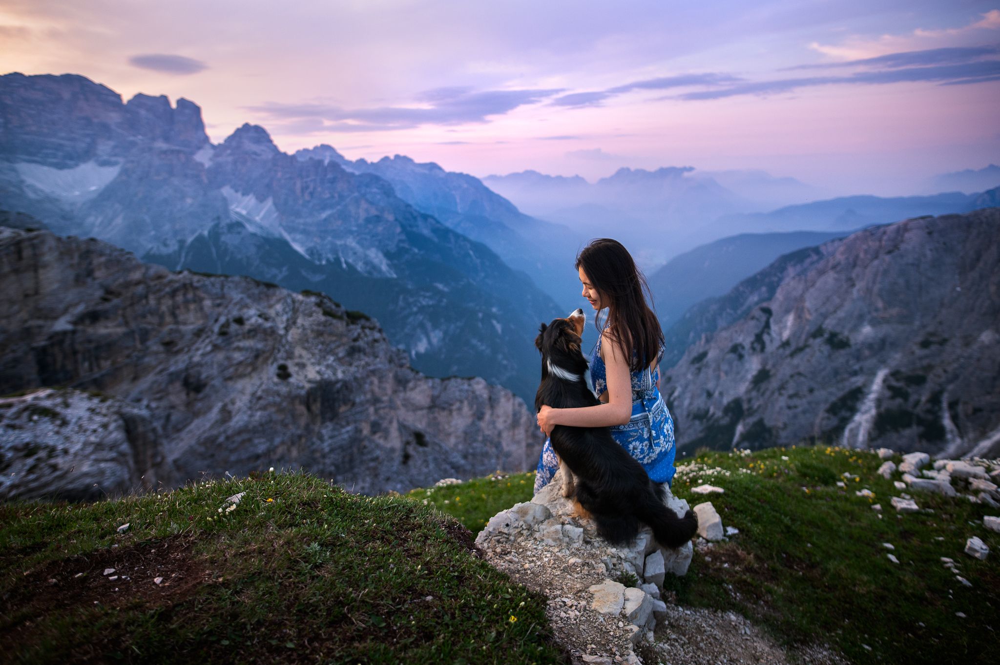 Girl and dog portrait in sunset light