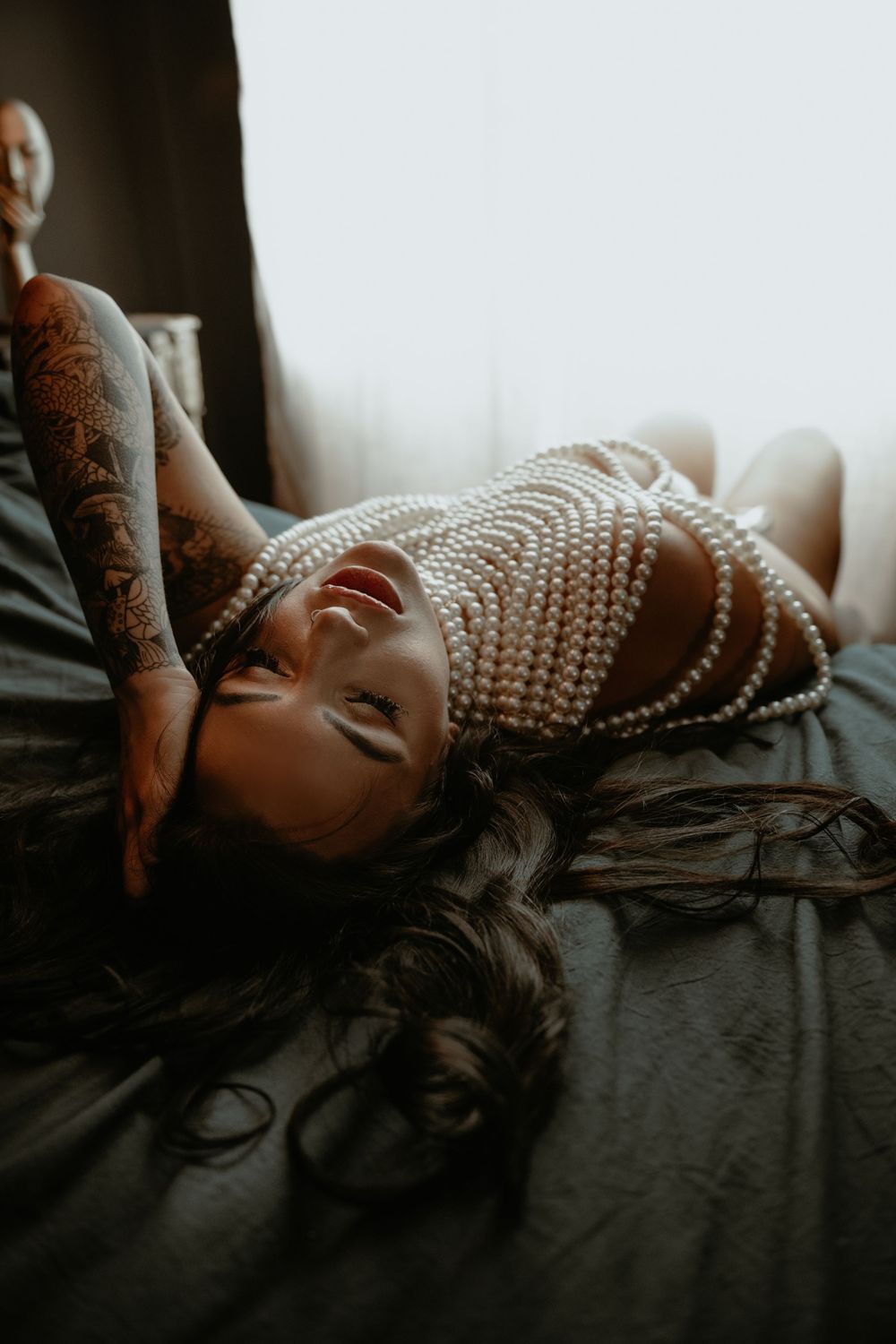 Woman photographed in lingerie during an indoor boudoir session in Utah