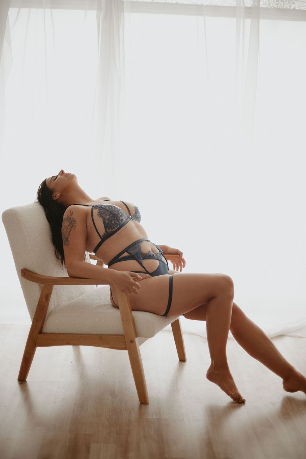 Woman photographed in lingerie during an indoor boudoir session in Utah