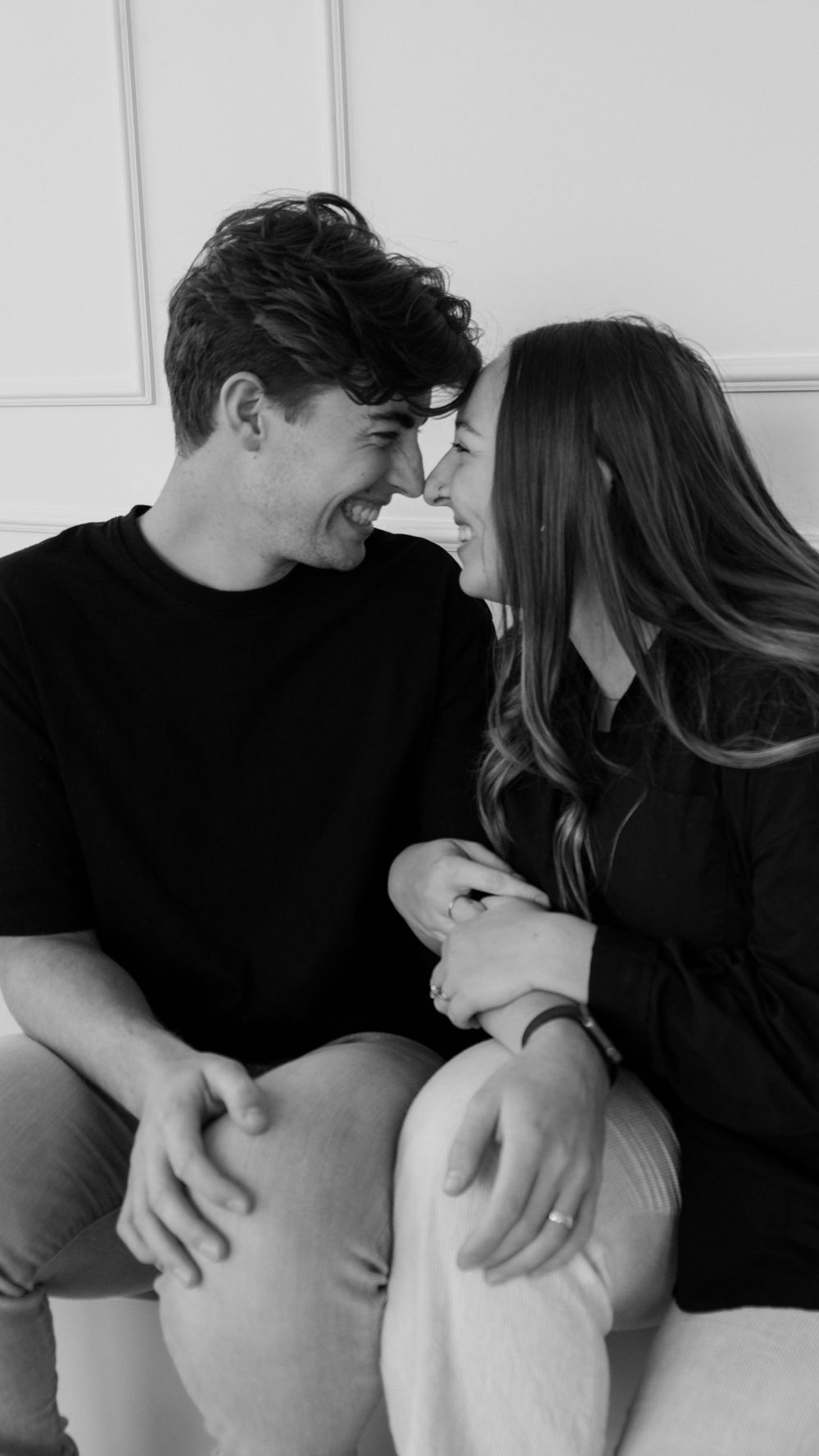 Couples photography with man and woman smiling and touching noses.