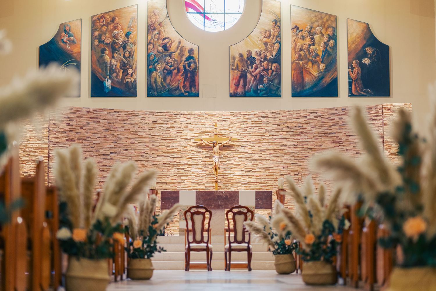 Church altar with decorations for wedding ceremony along the isle.