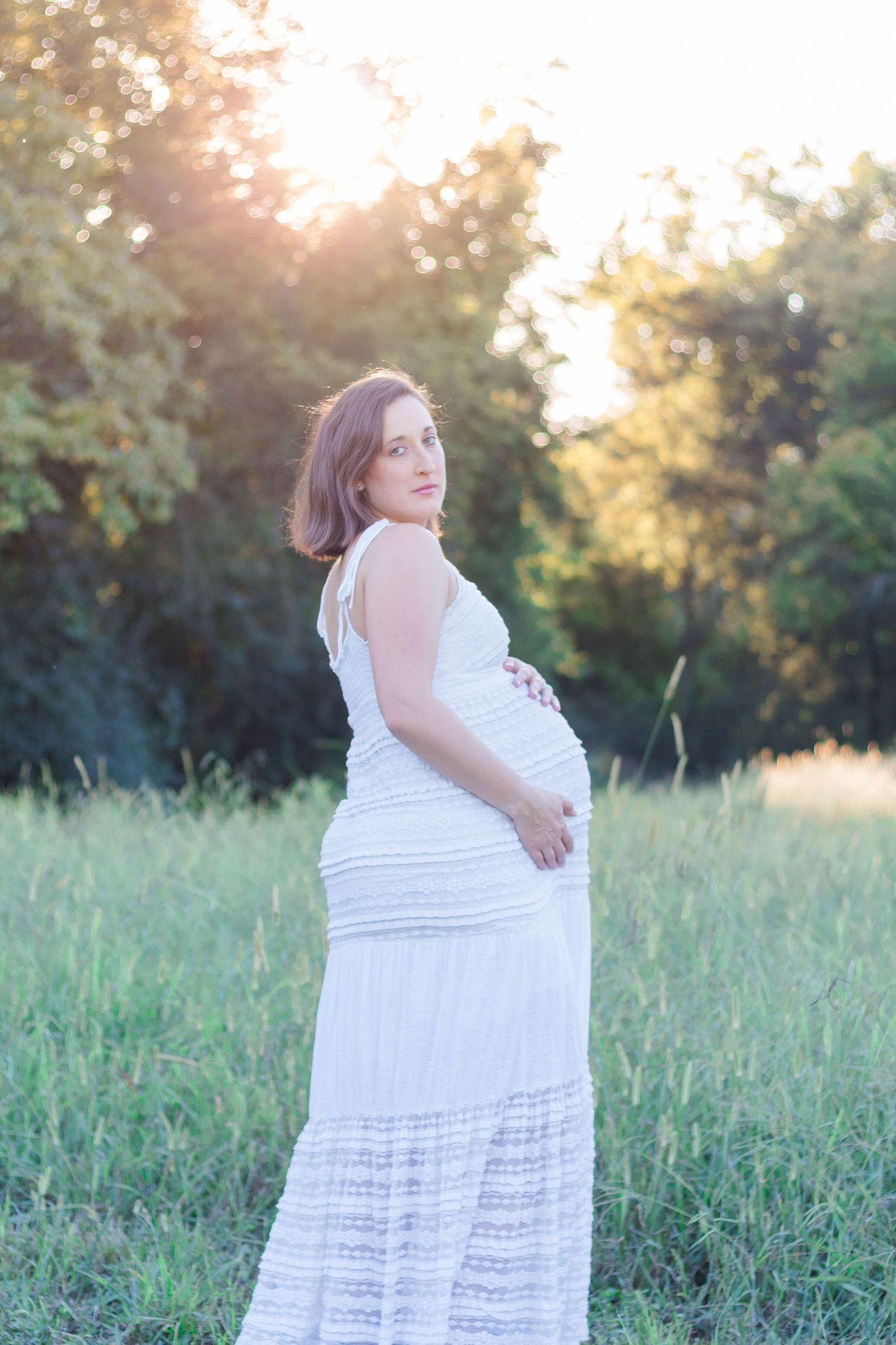 Pregnant mother looking at camera