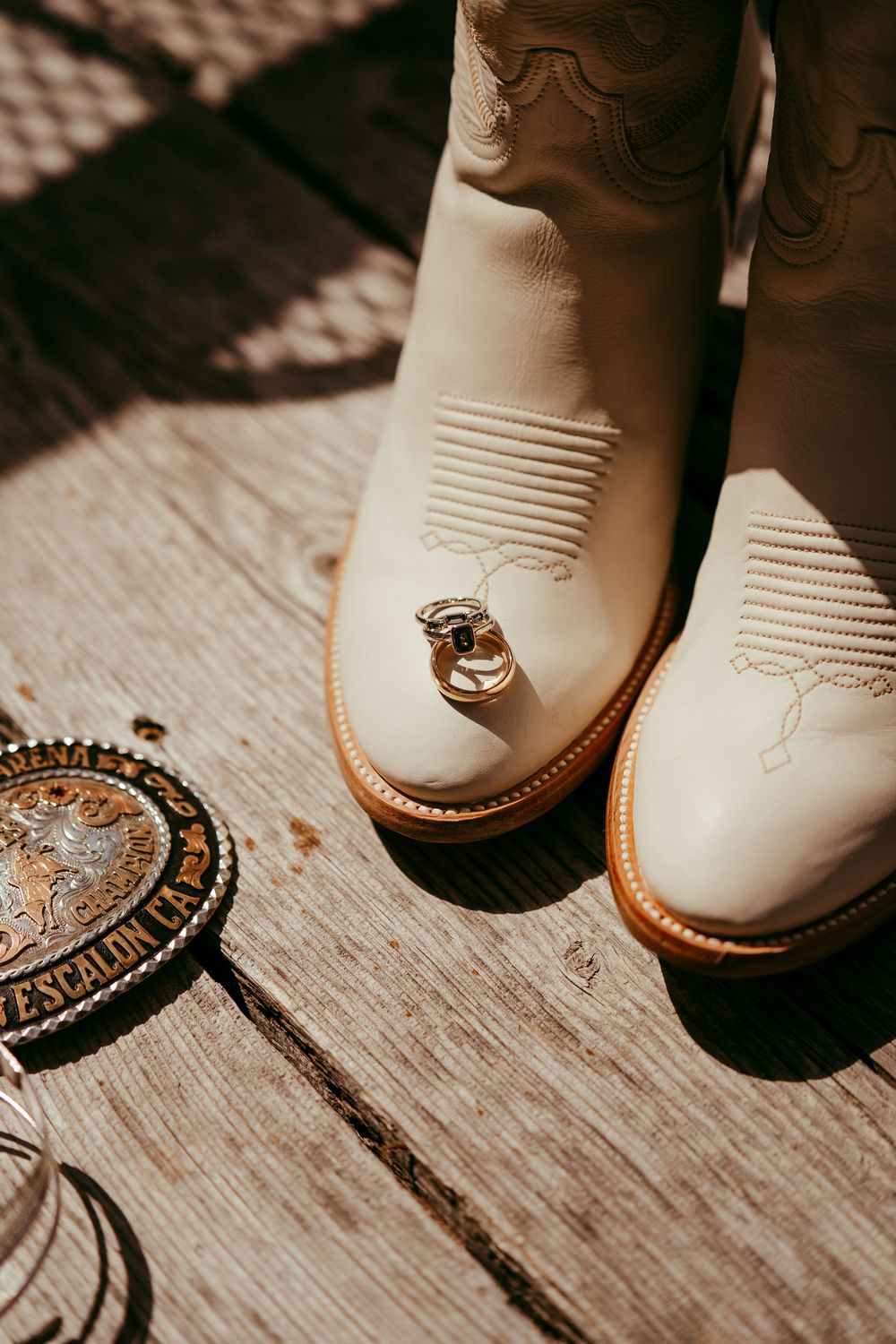 romantic western wedding portrait of a bride and groom embracing at sunset in the mountains