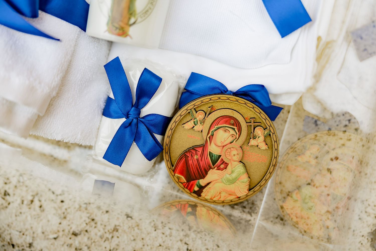 Religious icon with blue ribbons and decorative packaging.