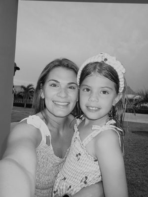 A series of four black and white selfie photos showing two people wearing matching outfits outdoors.