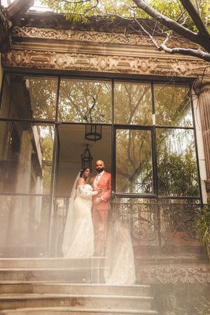 A series of wedding photos showing a couple in a misty garden gazebo with ornate architectural details.