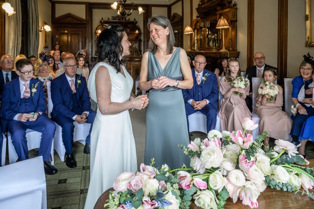 Two brides saying their wedding vows at Merewood Country House
