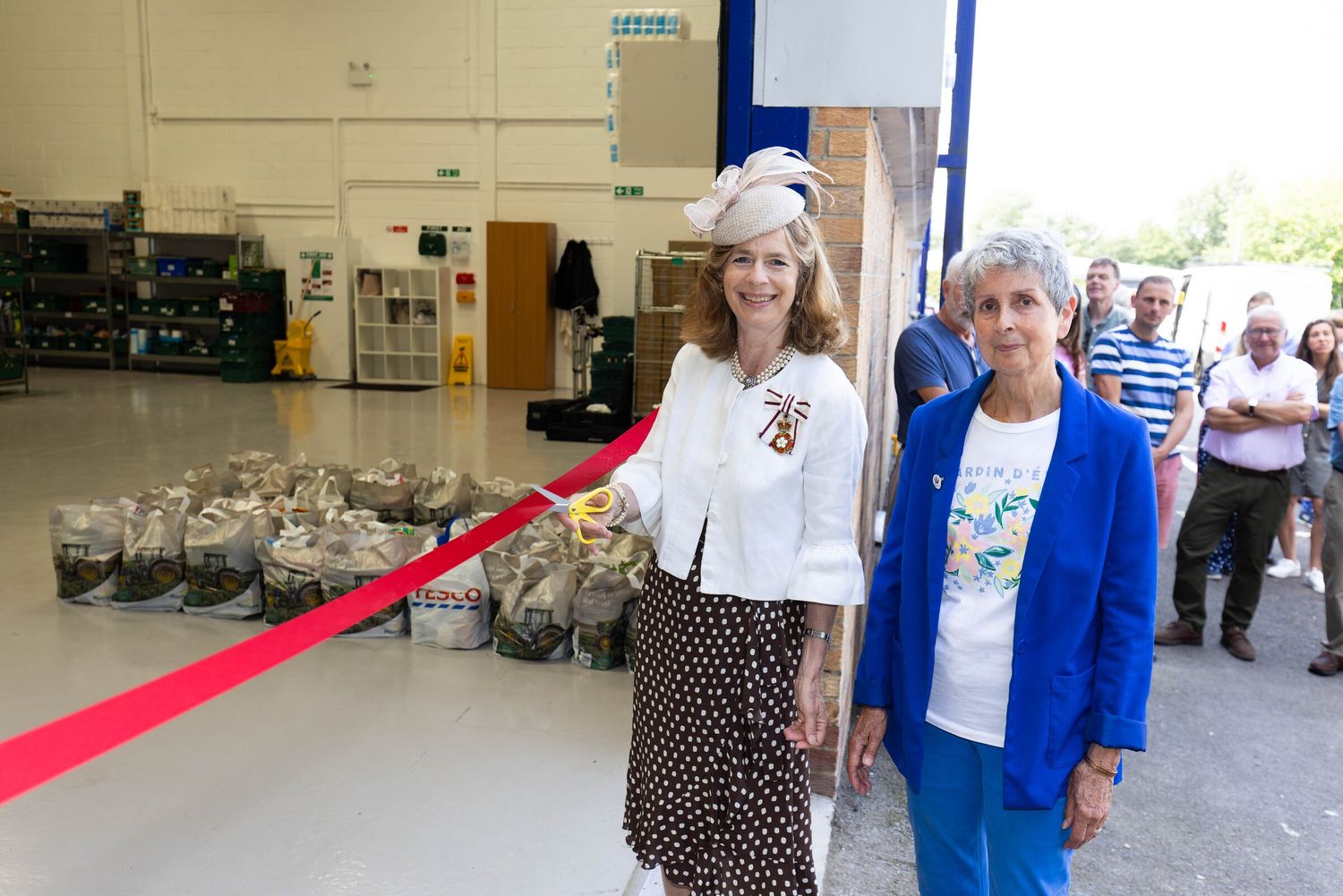 The Lady Colgrain cutting the ribbon at the opening of the Nourish community food bank in Tunbridge Wells
